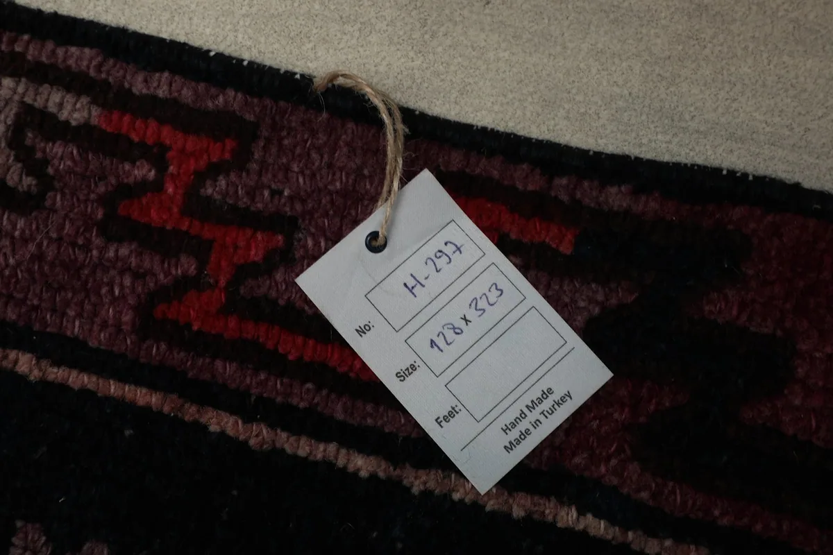 Size and origin tag attached to the vintage Anatolian runner rug