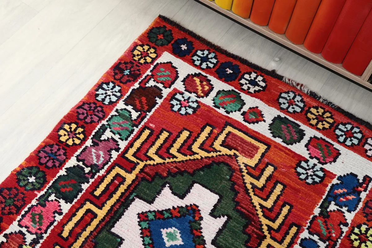 Corner view of the runner showing the intricate border and central geometric design