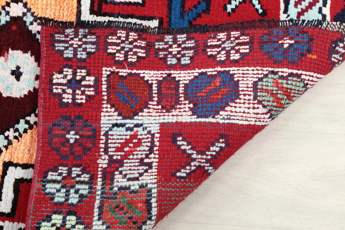 Detail of the reverse side of the rug, showing the wool knots and cotton foundation
