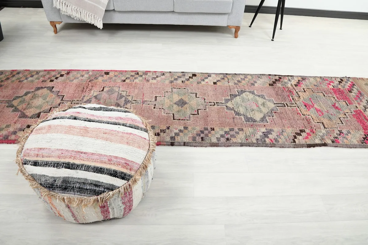 Long view of the runner rug in a room, emphasizing its length and how it defines the space.