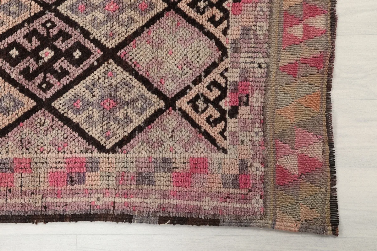 Detailed view of the end border and geometric patterns of the Anatolian runner rug