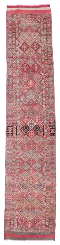 Full overhead view of a rose and gray geometric Anatolian runner rug