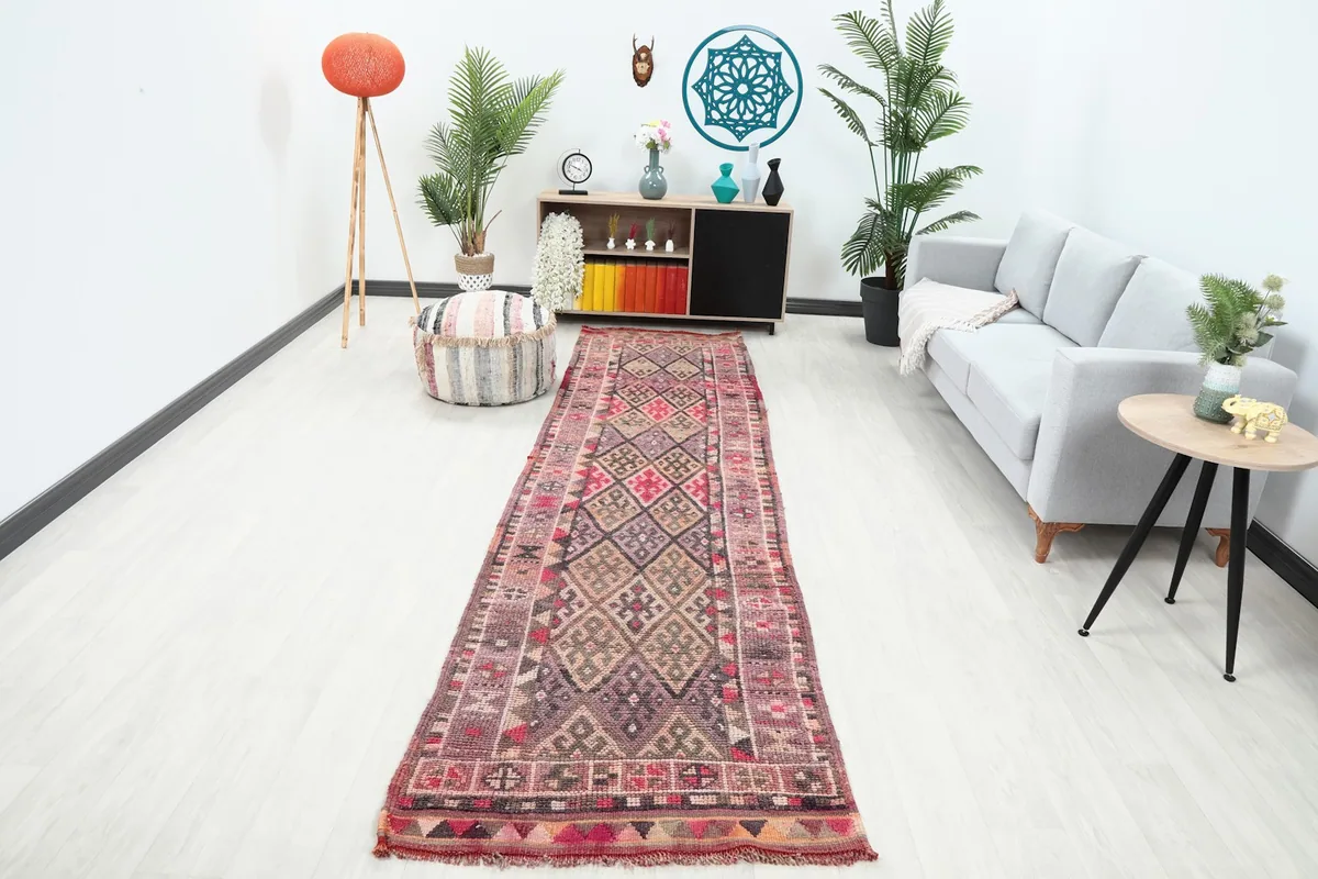 Vintage Anatolian runner rug displayed in a modern living room setting