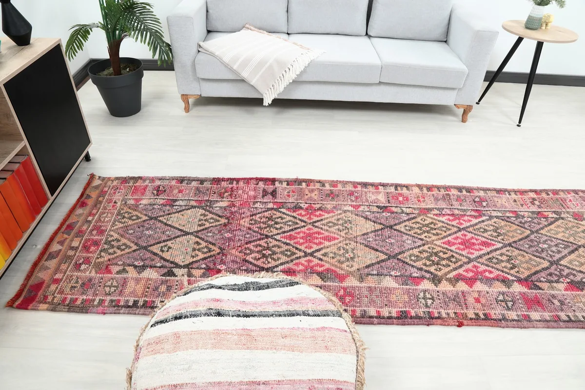 Room view showing the runner rug extending from the seating area