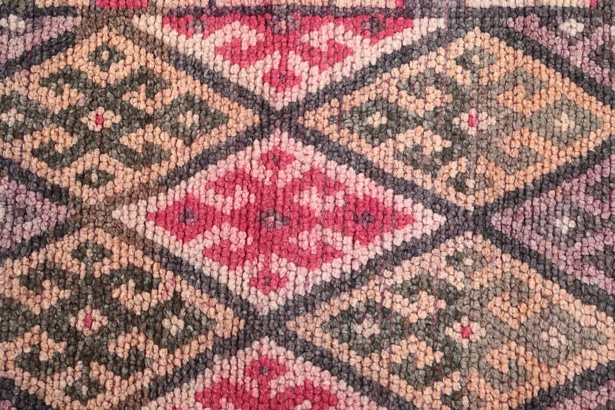 Close-up of the low wool pile and intricate hand-knotted patterns