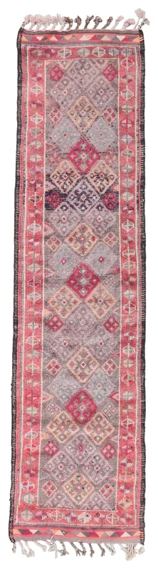 Full overhead view of a vintage rose and gray geometric runner rug on a white background
