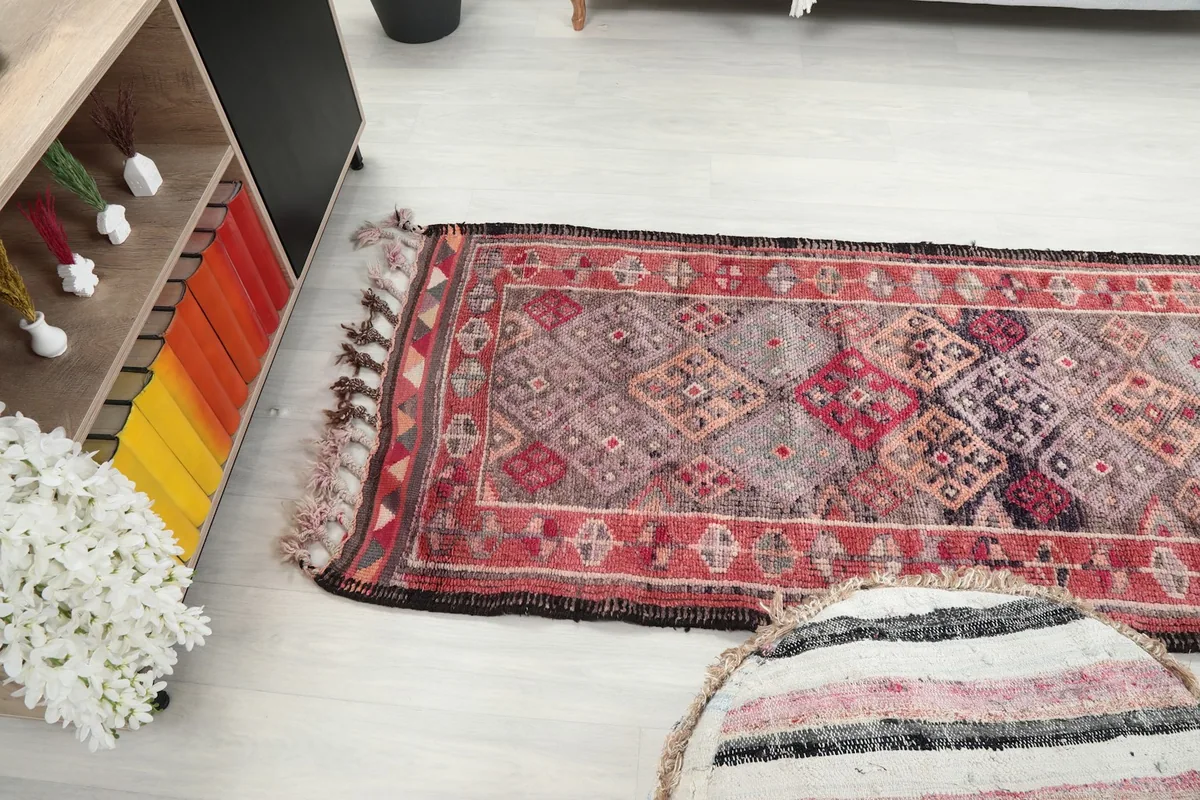 Runner rug laid out in a contemporary living space, viewed from an elevated angle