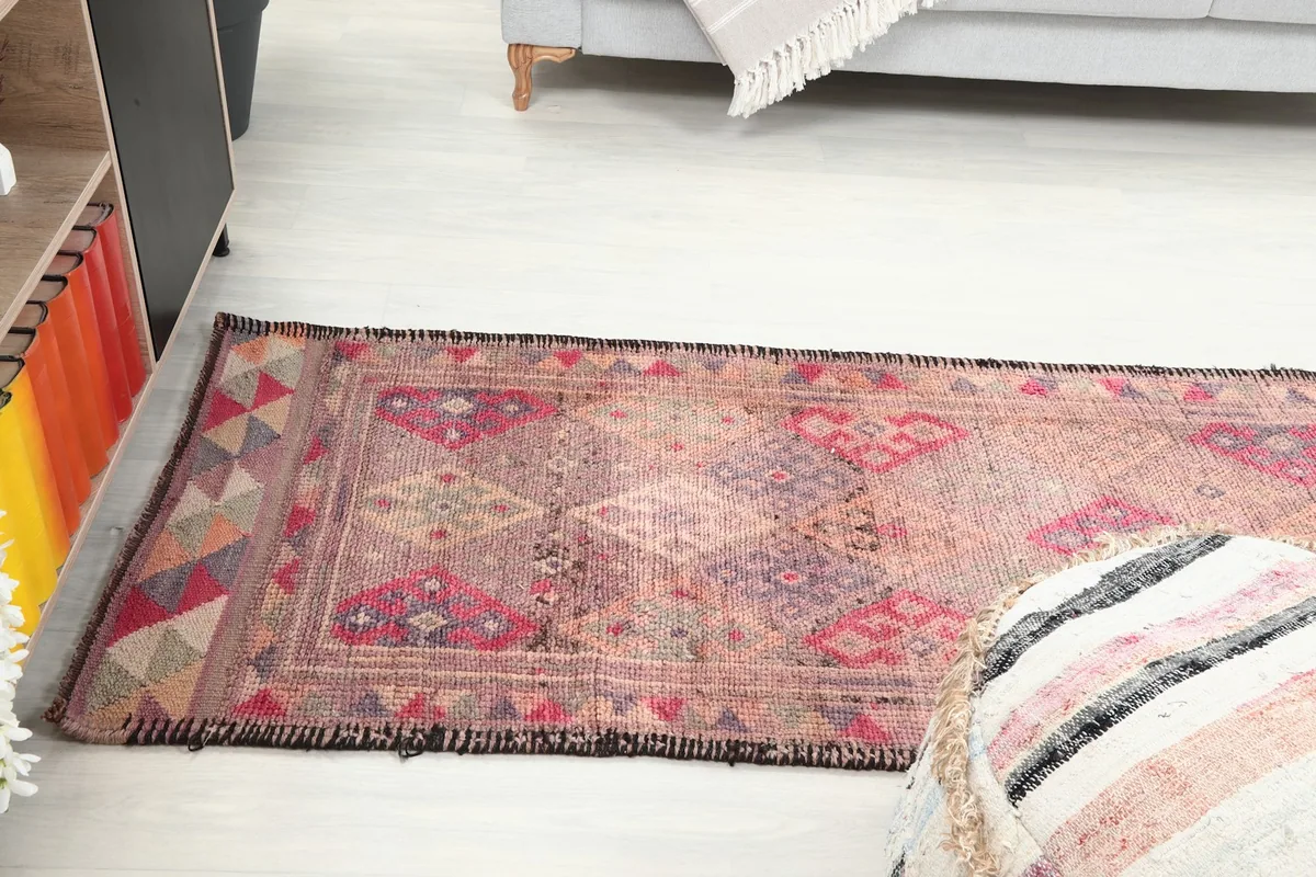 View of the runner rug extending from a seating area in a home
