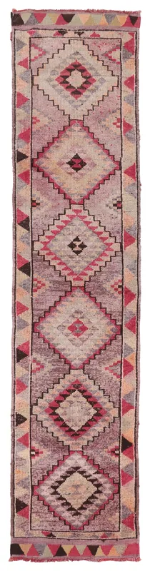 Full overhead view of the vintage Anatolian runner rug with rose and gray geometric patterns