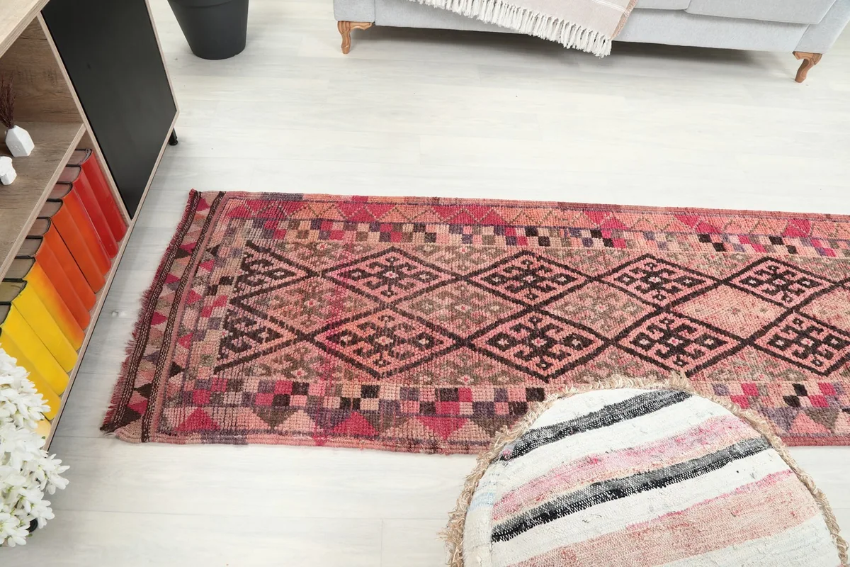 Wider room shot of the runner rug, showing its presence and scale within a living space.