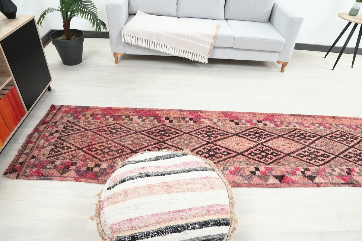 Full length view of the runner rug in a room, providing context for its size and design.