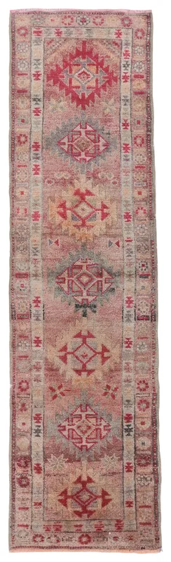 Full top view of the 2'10" x 10'6" rose tribal geometric runner rug on a white background.
