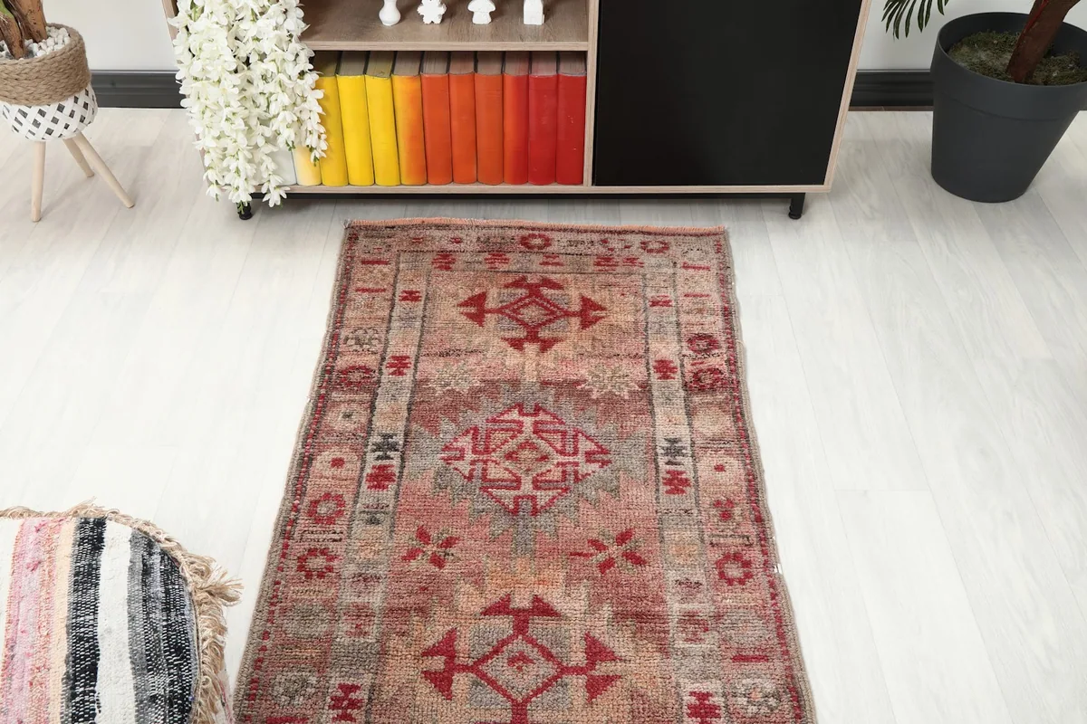 Overhead view of a section of the runner rug, focusing on the central patterns and color transitions.