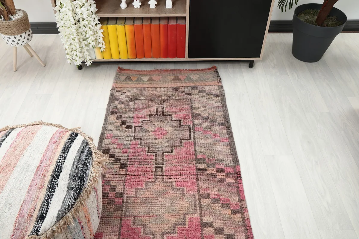 Overhead view of the vintage runner rug, highlighting its full pattern and color scheme