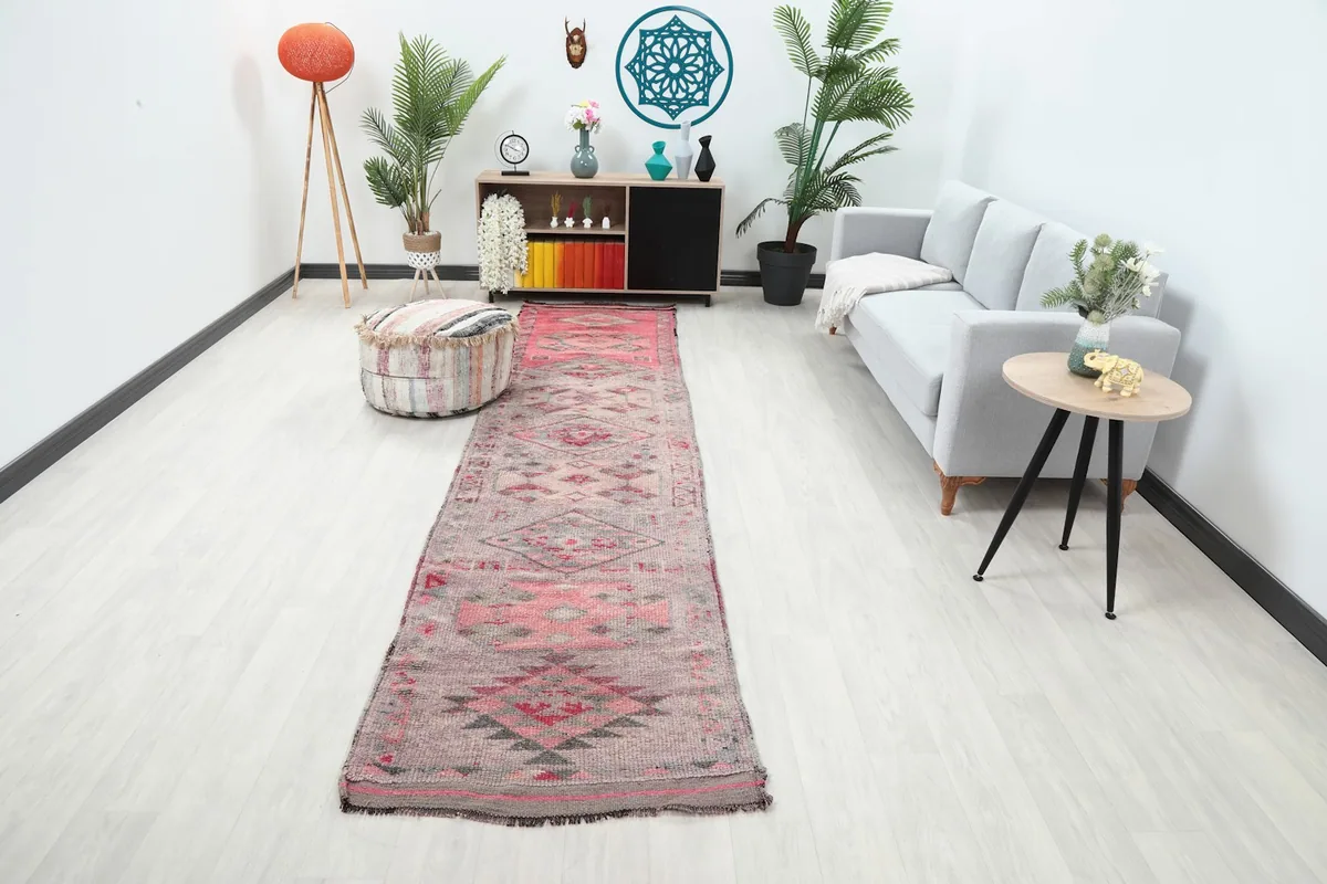 Vintage Anatolian runner rug displayed in a modern living room setting