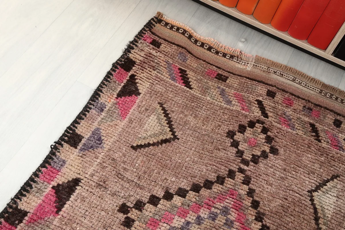 Corner angle view of the runner rug, highlighting the pattern and color variations