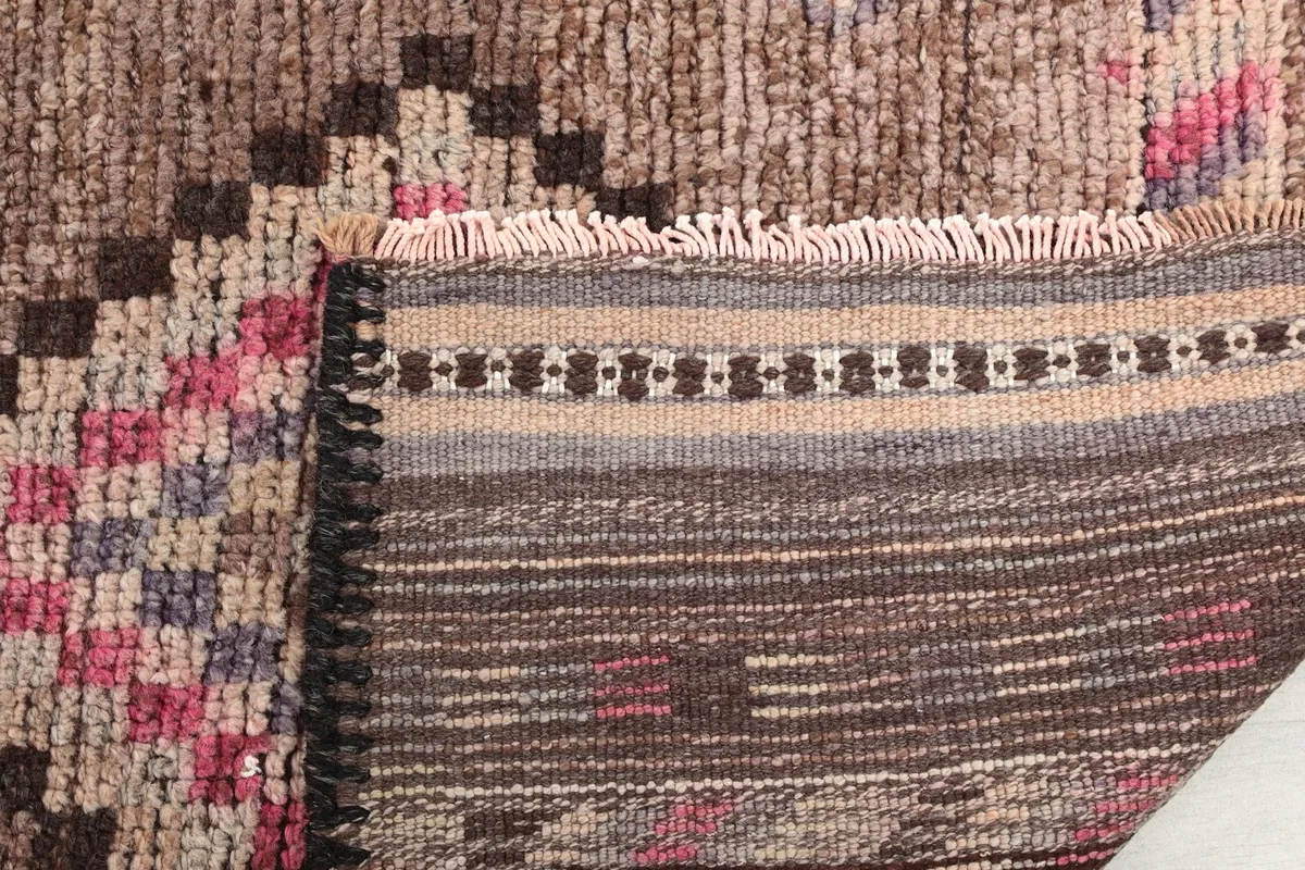 Close-up of the fringe and the back of the hand-knotted wool runner rug