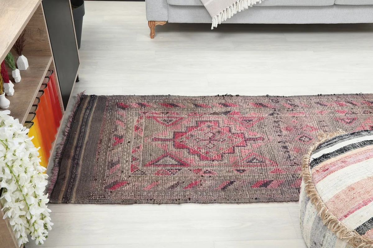 Runner rug stretching across a room, viewed from a higher angle