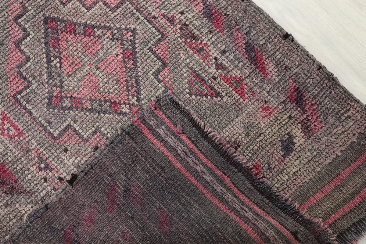 Folded section of the rug, showing the pile and the reverse side detail
