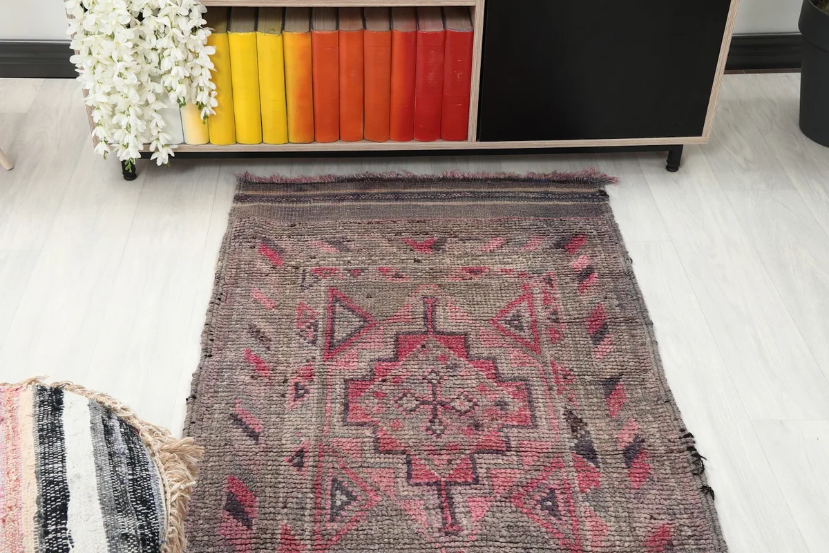 Overhead view of one end of the runner rug, showing the main design and color palette