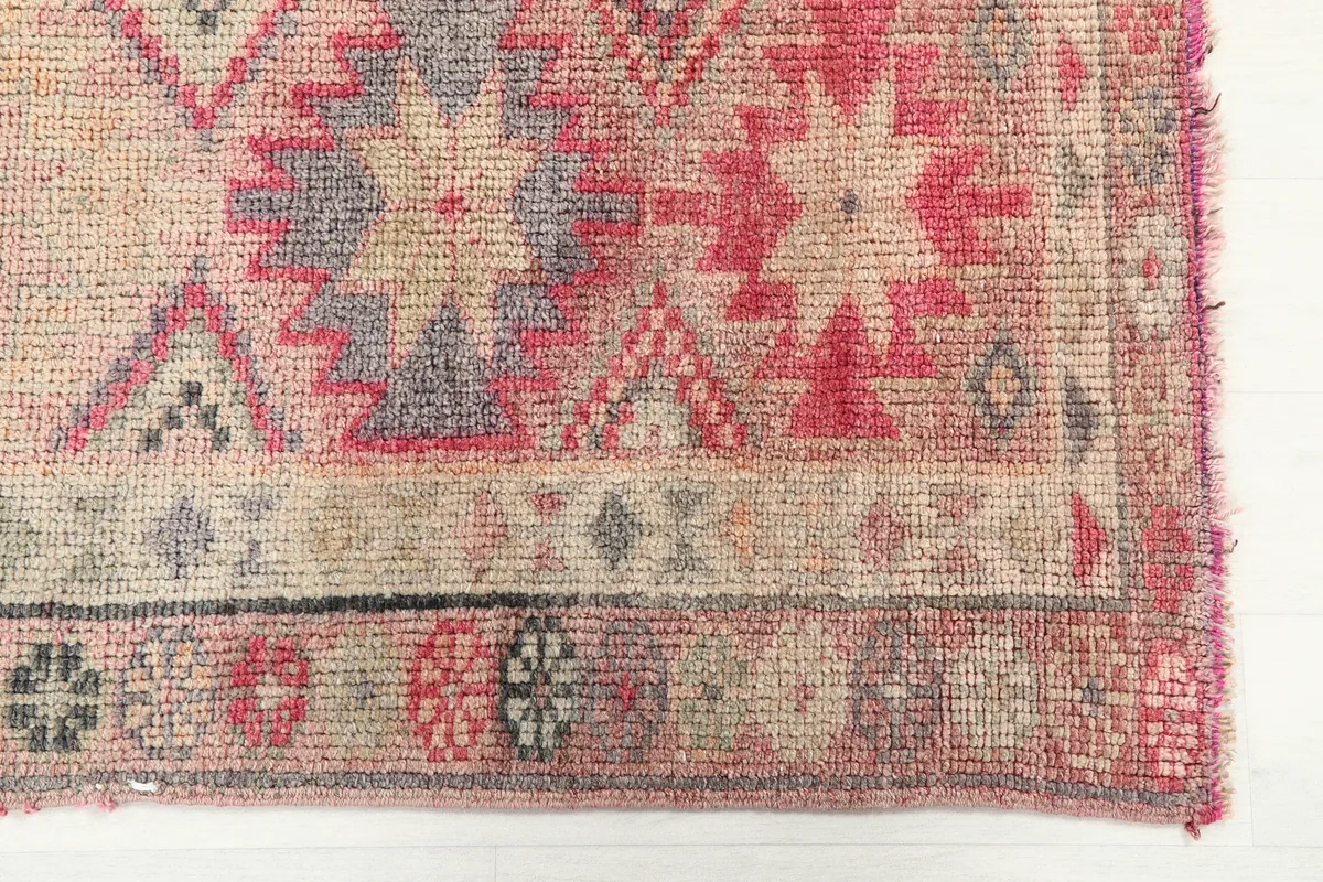 Detail of the Soft Rose Geometric Anatolian Runner, showing the geometric patterns and muted colors.