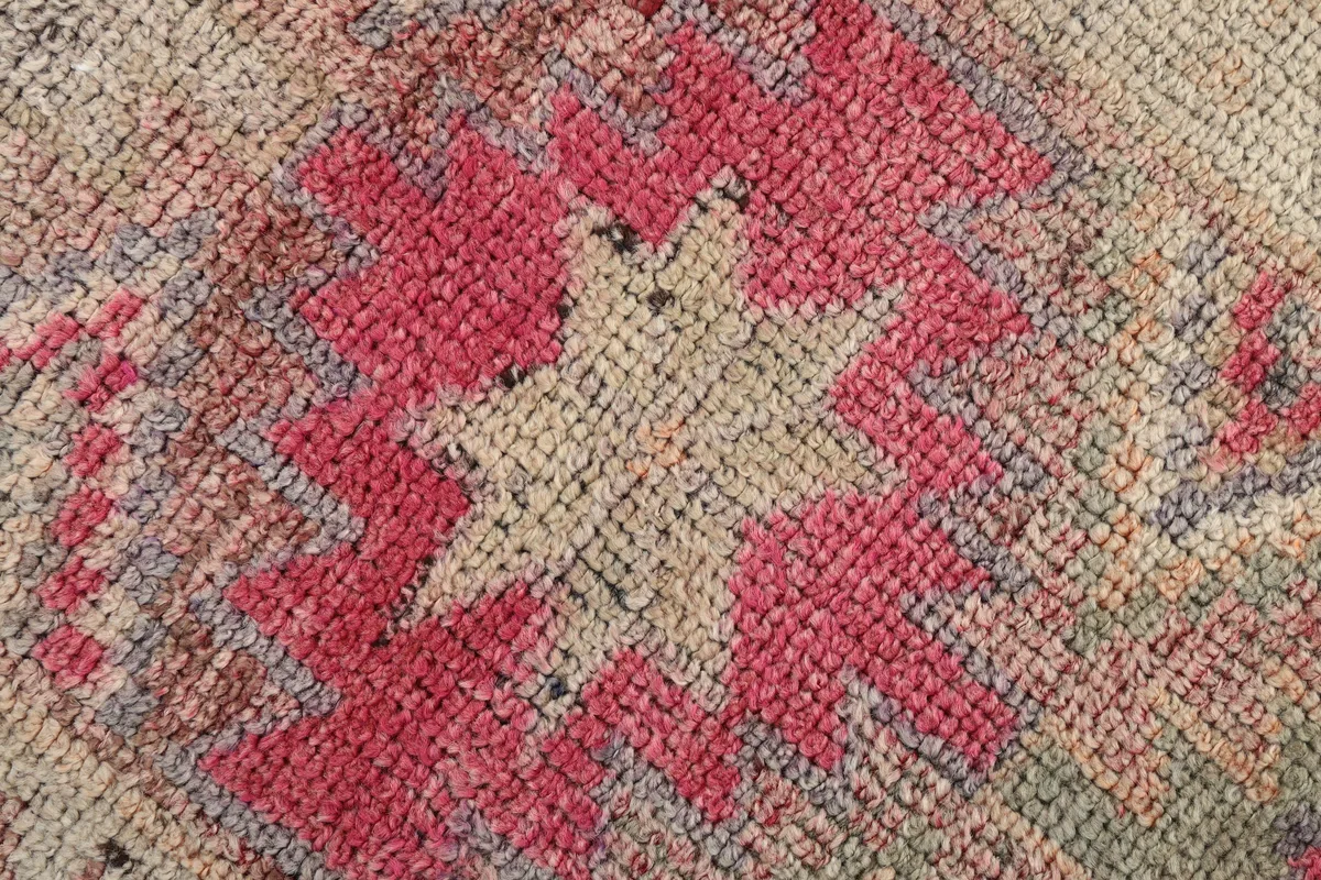 Tight detail of the Soft Rose Geometric Anatolian Runner's low pile and intricate weave.