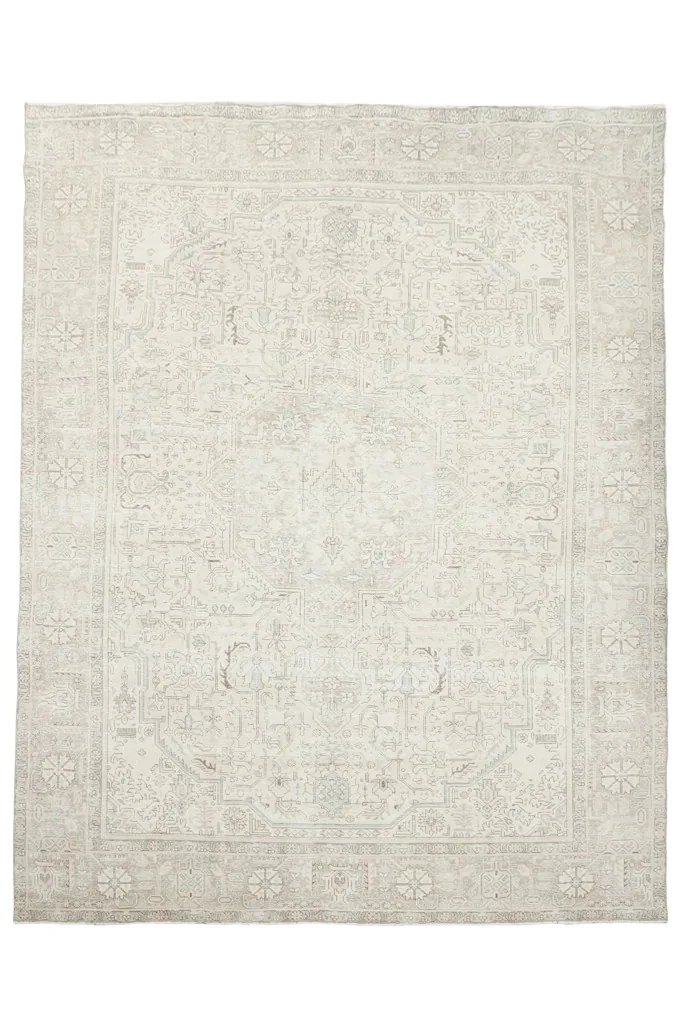 Overhead view of the hand-knotted beige and gray Persian rug showcasing its full design.