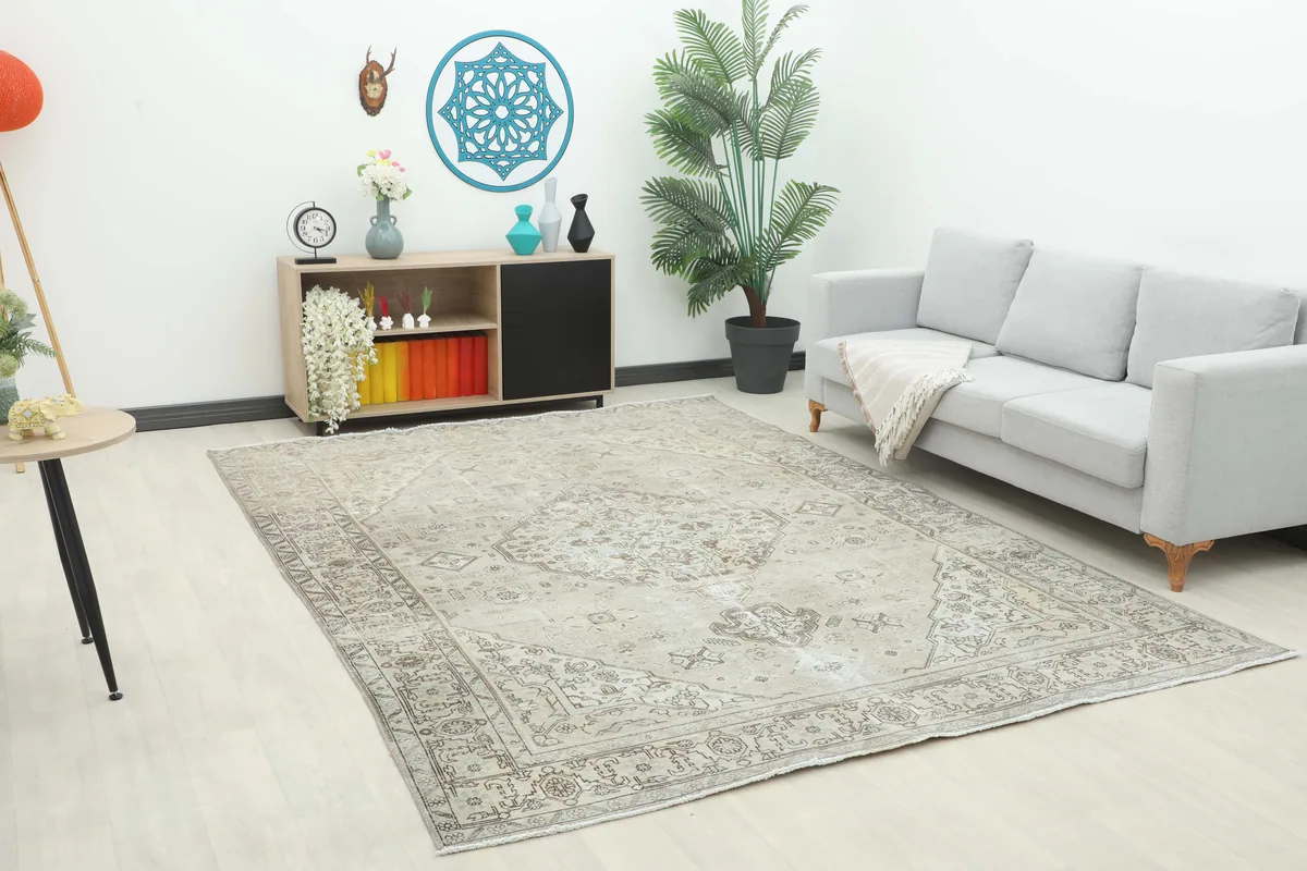 Cream Medallion Persian Rug in a bright room setting, showing its large size and neutral tones.