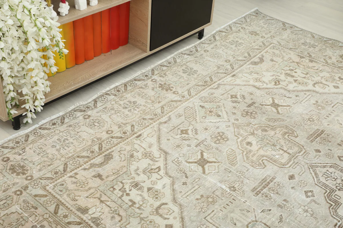 Angled view of the Cream Medallion Persian Rug, showcasing the overall pattern and soft color variations.