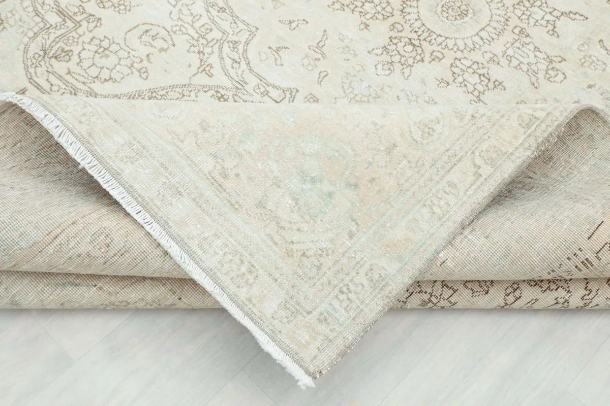 Underside view of the hand-knotted cotton foundation of the vintage Persian rug
