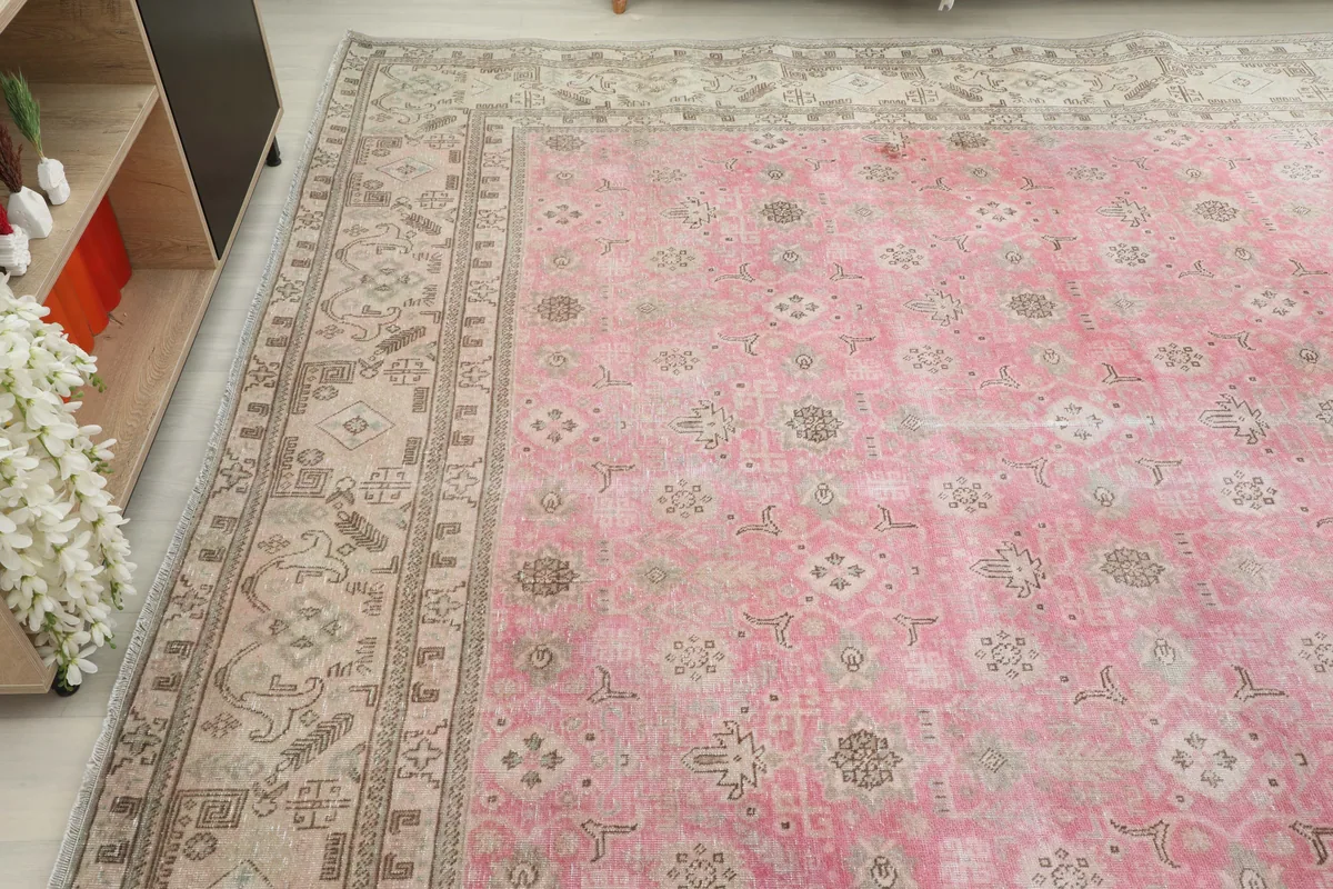 Another angled view of the oversized Persian rug, highlighting the full pattern and color variations.