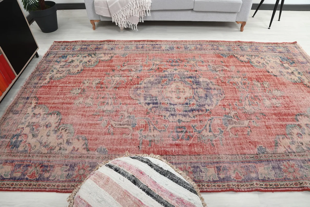 Full room view of the red and purple area rug with furniture