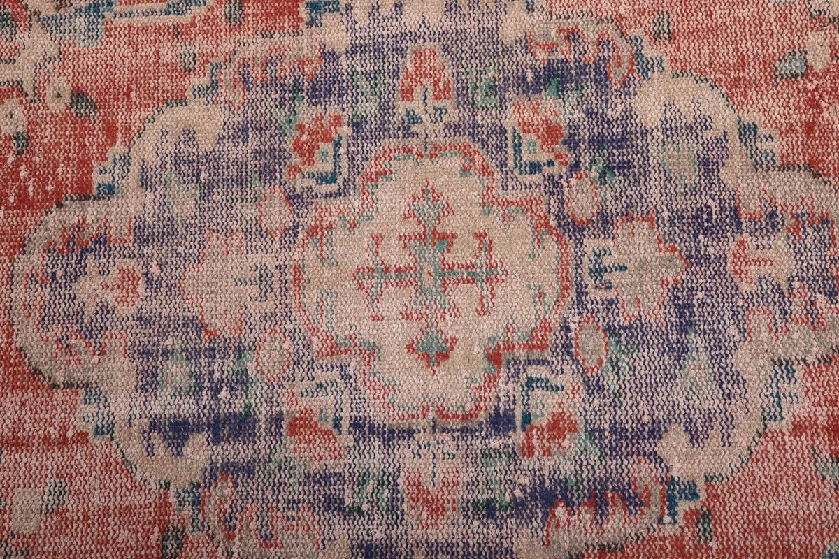 Close-up of the central purple medallion and surrounding beige patterns