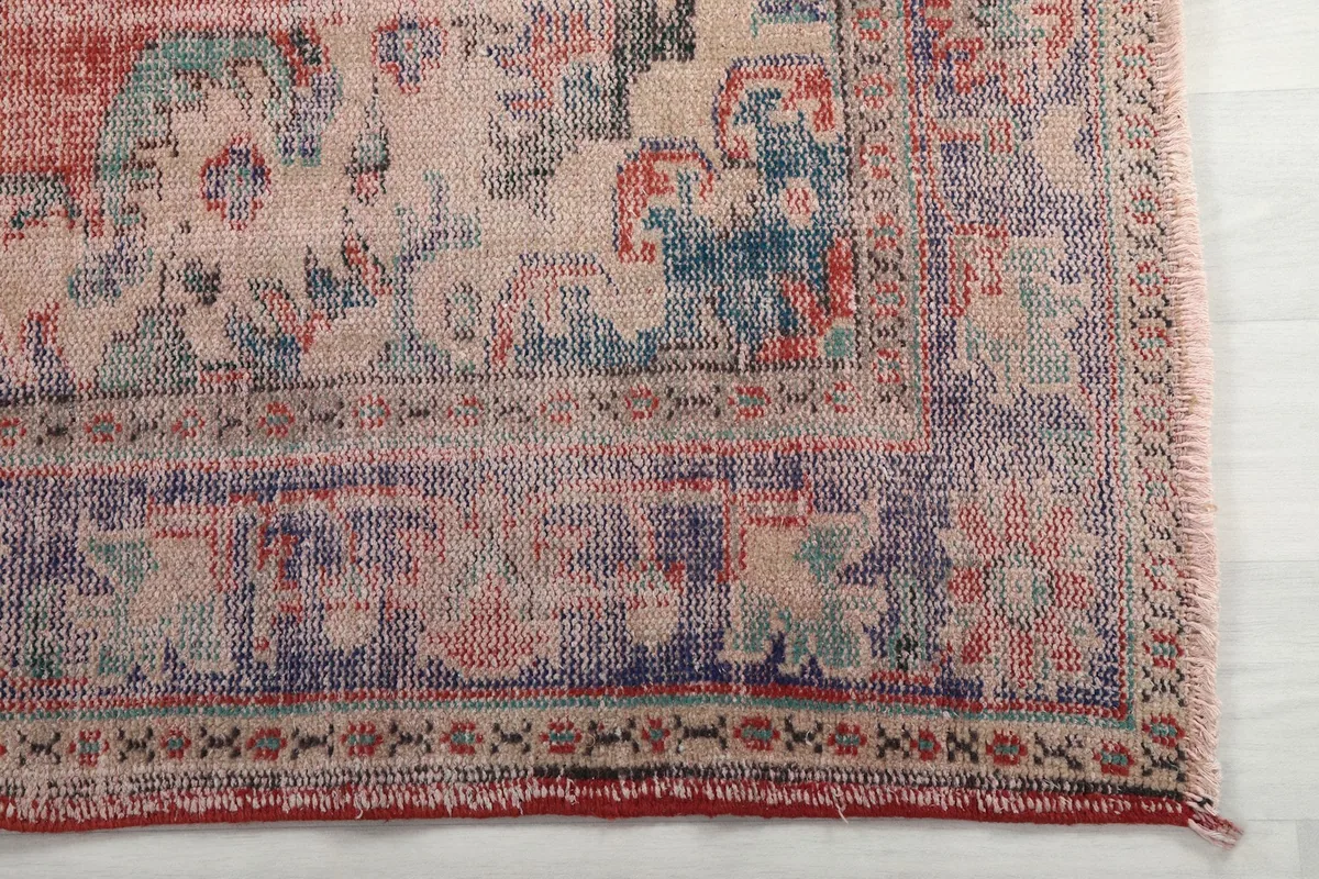Detailed view of the outer border and corner of the vintage rug