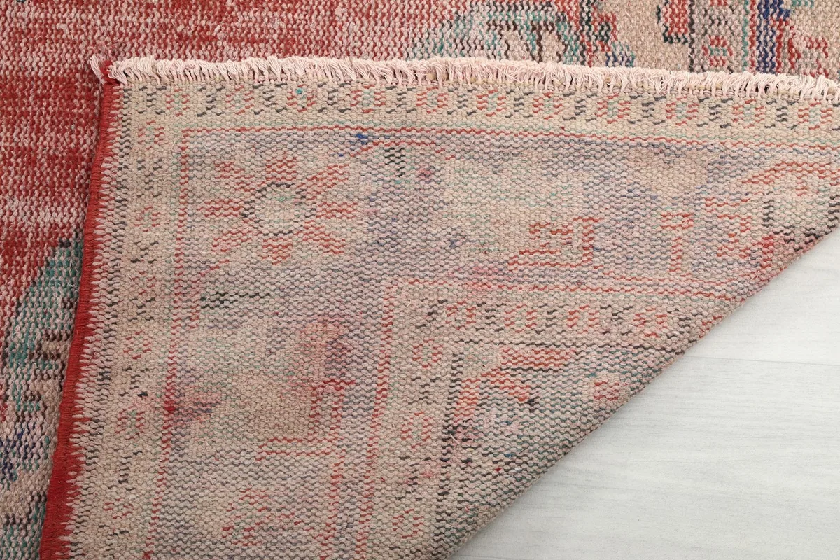 Close-up of the back of the hand-knotted wool rug, showing the foundation