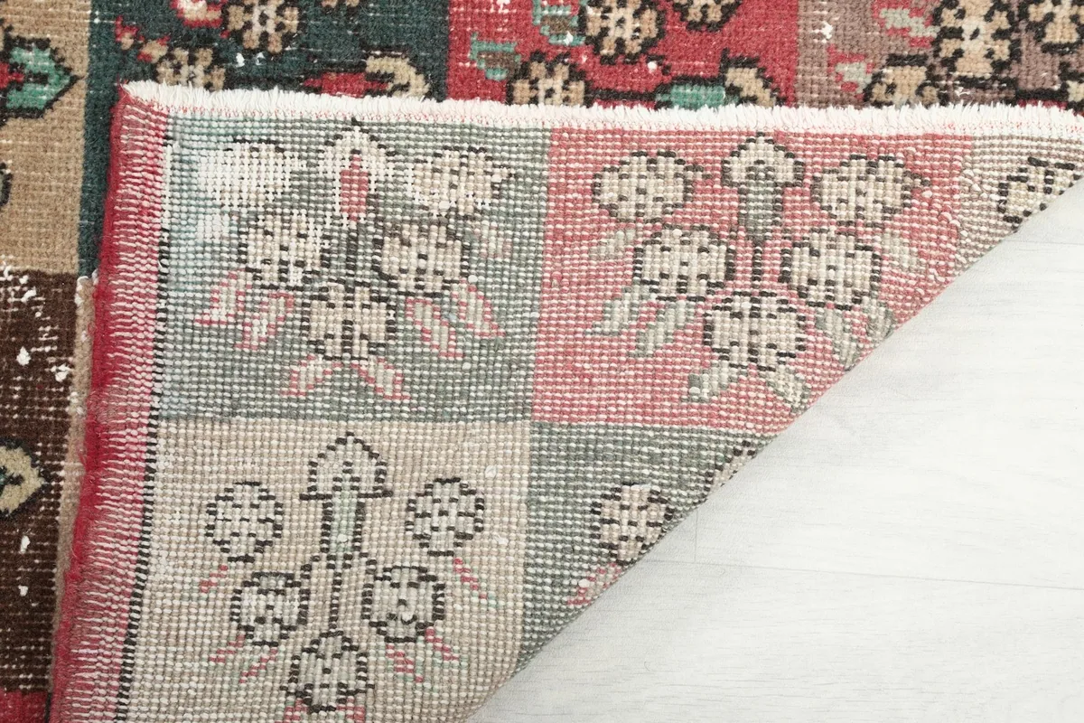 Another view of the rug's reverse side, illustrating the craftsmanship and weave
