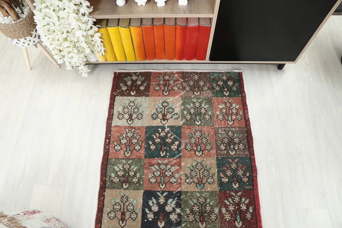 Overhead view of the vintage runner rug, focusing on its central design in a room