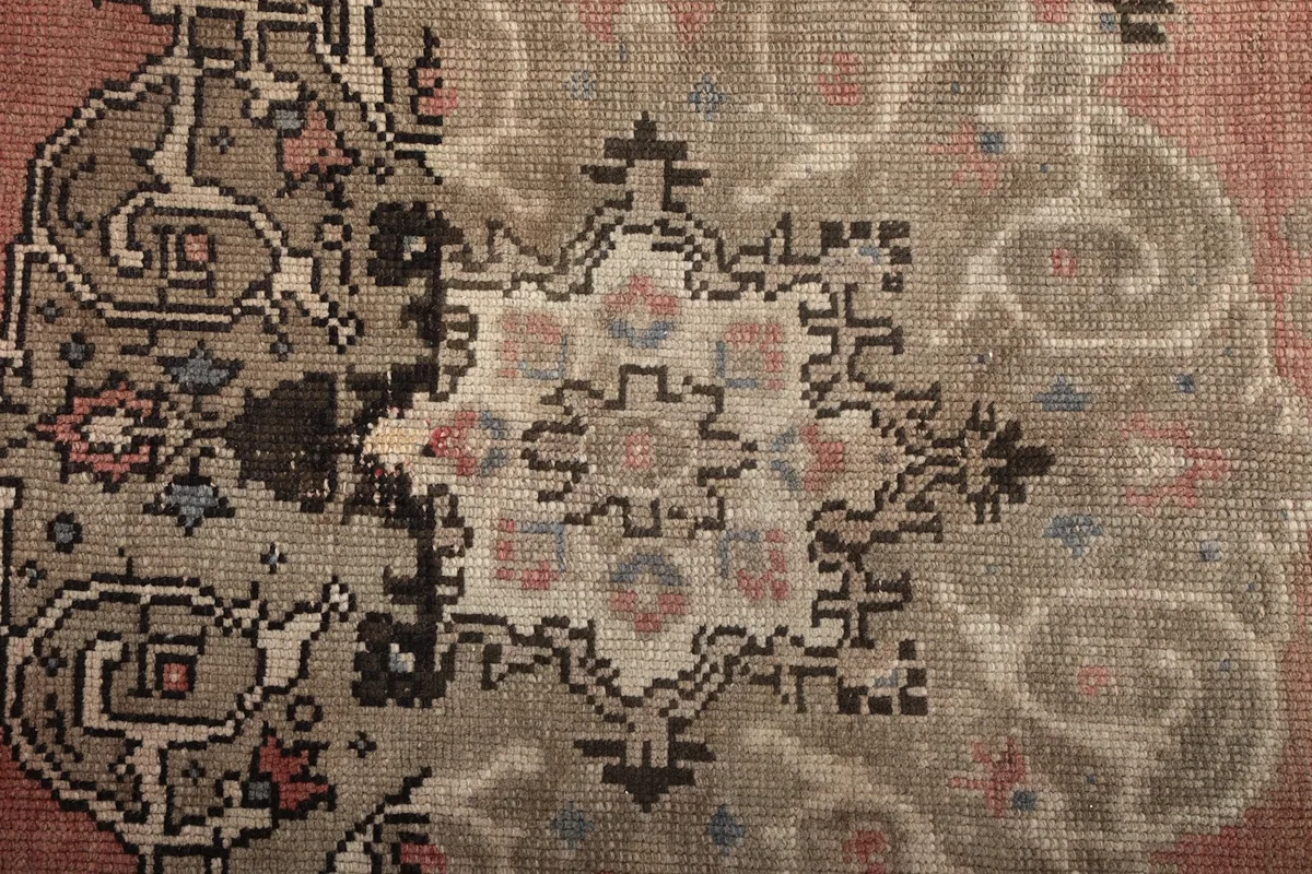 Intricate detail of the medallion pattern with varied colors and textures