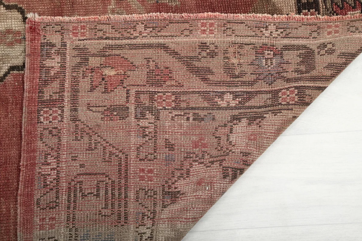 Underside of the rug showing the hand-knotted cotton foundation and weave
