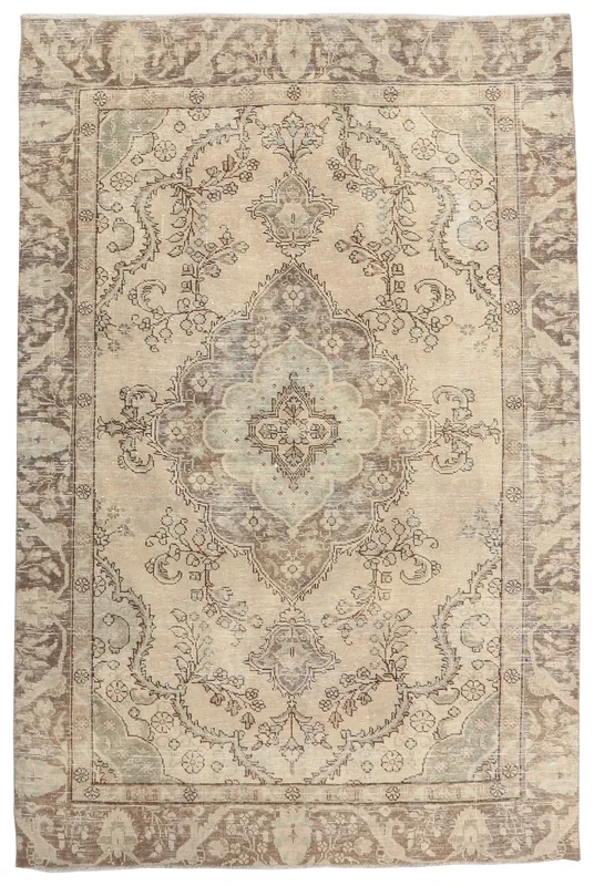 Full overhead view of the beige and brown floral medallion vintage Anatolian rug