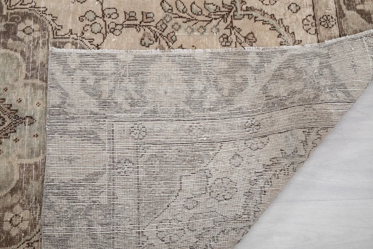 Close-up of the rug's underside, showing the reverse of the hand-knotted construction