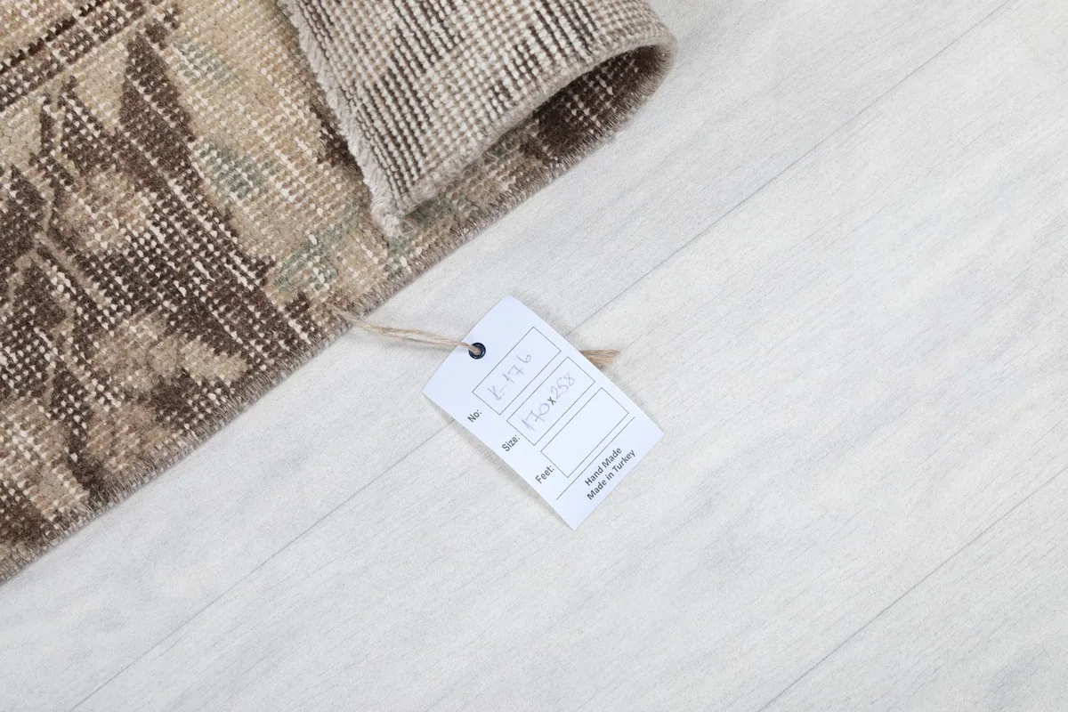 Rug corner with a product tag, indicating its origin and material details