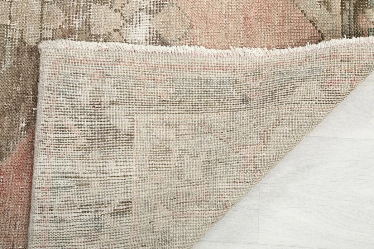 Close-up of the hand-knotted fringe and the reverse side of the rug