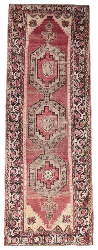 Full top view of the 3'11" x 11'2" red and beige geometric Anatolian runner rug on a white background.