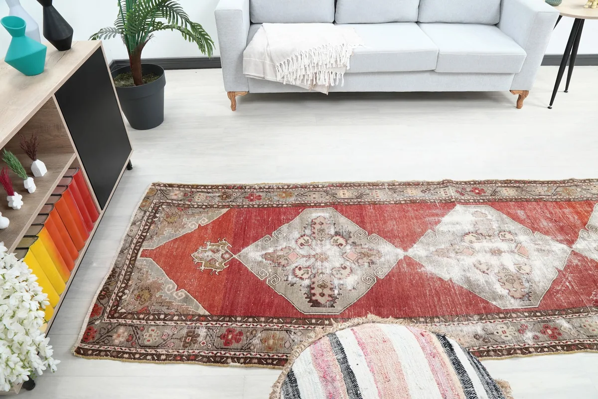 View of the runner rug in a room, showing its placement relative to a sofa and side table.