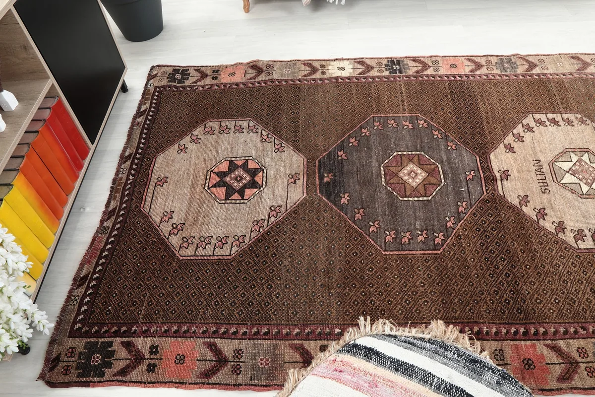 Overhead view of the rug's central section, revealing multiple medallions
