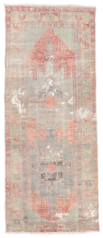 Full top view of the rust and gray distressed geometric runner rug on a white background.