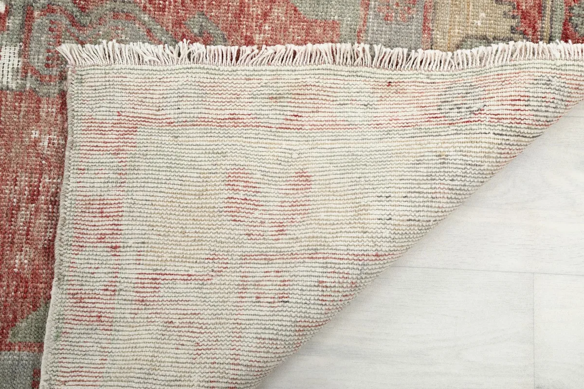 Underside of the rug, showing the consistent hand-knotted construction and cotton foundation.