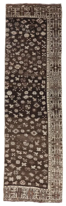 Full top view of the 2'9" x 9'10" brown tribal geometric runner rug on a white background.