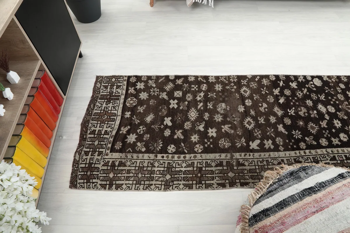Overhead view of the runner rug placed in a room, capturing its length and overall appearance.
